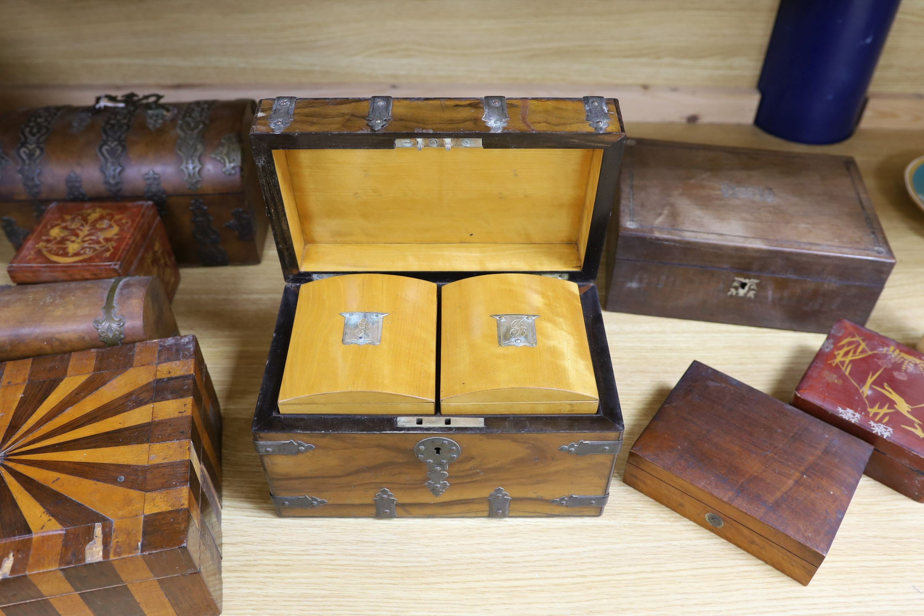 A Victorian Walnut and brass strap mounted tea caddy together with two caskets and five other boxes (8)